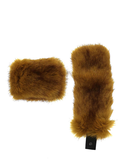 Shop Saint Laurent Cuffs In Vegetal Fur In Beige