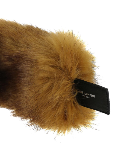 Shop Saint Laurent Cuffs In Vegetal Fur In Beige