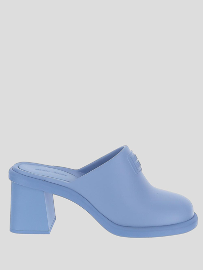 Shop Miu Miu Embossed Logo Mules In Blue