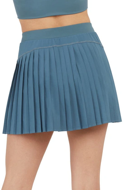 Shop Spanx Pleated Skort In Storm Blue