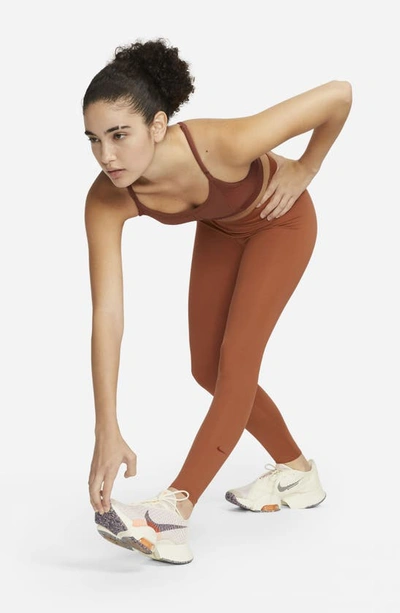 Shop Nike One Luxe Tights In Burnt Sunrise/ Clear