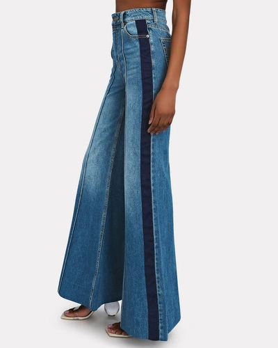 Shop Zimmermann Rhythmic Satin-trimmed Super Flared Jeans In Blue-med