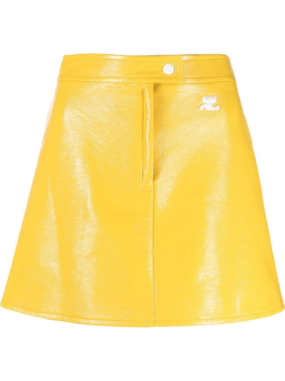 Shop Courrèges Logo-patch Vinyl Mini Skirt In Gelb
