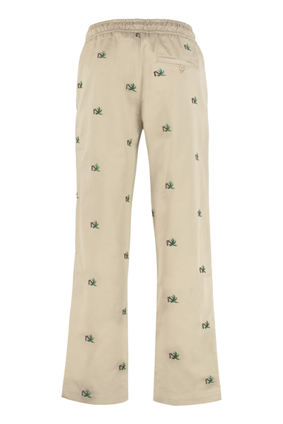 Shop Palm Angels Embroidered Cotton Trousers In Beige