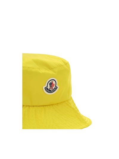 Shop Moncler Bucket Hat In Yellow