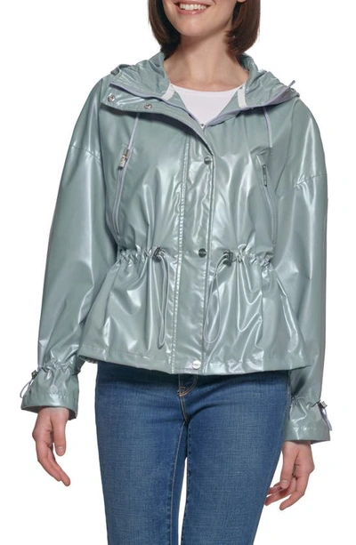 Shop Guess Hooded Holographic Anorak Rain Coat In Light Blue