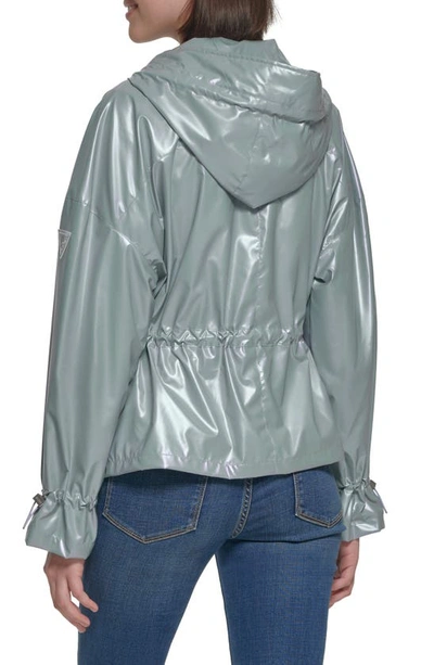 Shop Guess Hooded Holographic Anorak Rain Coat In Light Blue