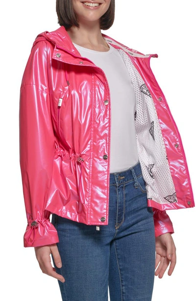 Shop Guess Hooded Holographic Anorak Rain Coat In Bubble Gum