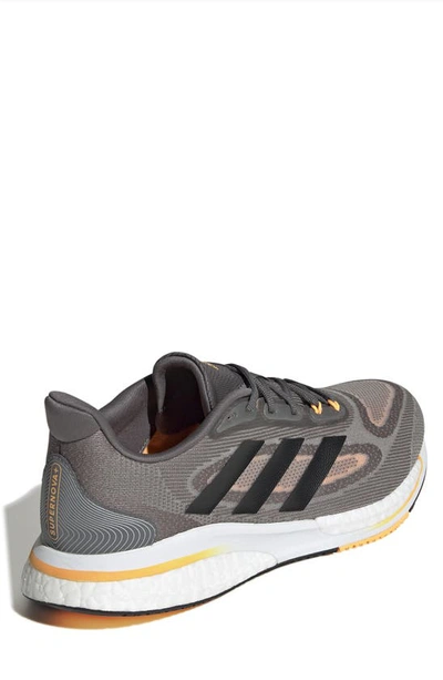 Shop Adidas Originals Supernova Running Shoe In Grey Four/ Black/ Orange