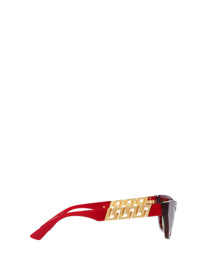 Shop Versace Eyewear Sunglasses In Transparent Red