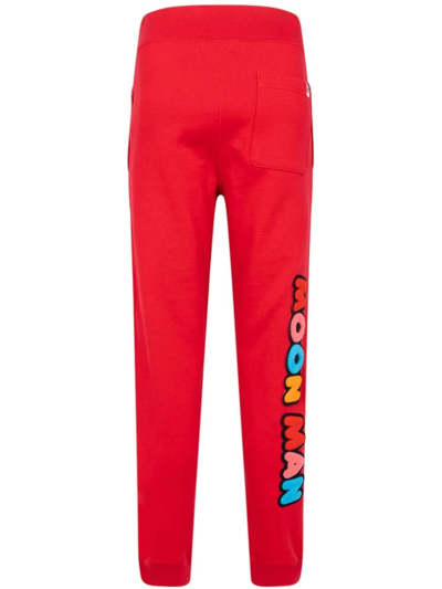 A Bathing Ape X Kid Cudi Track Pants In Red
