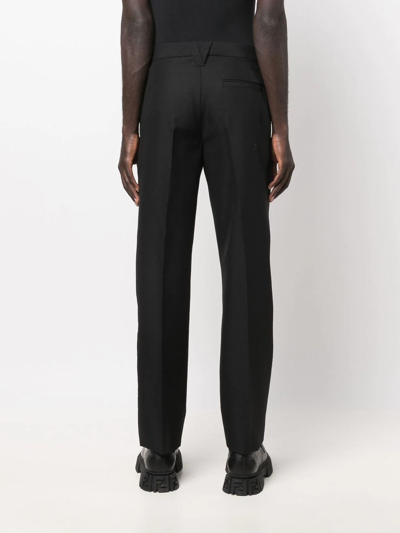 Shop Versace Tailored Wool Trousers In Black