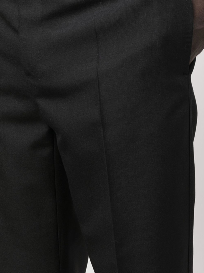 Shop Versace Tailored Wool Trousers In Black