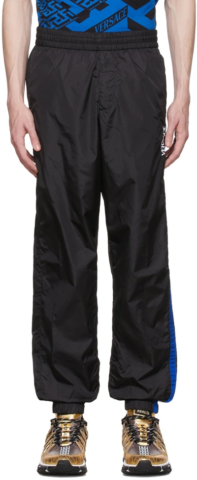 Shop Versace Black Nylon Track Pants In 1b000 Black