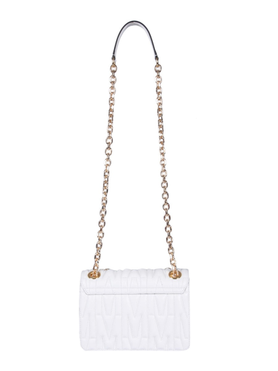 Shop Moschino Quilted Logo Shoulder Bag In White
