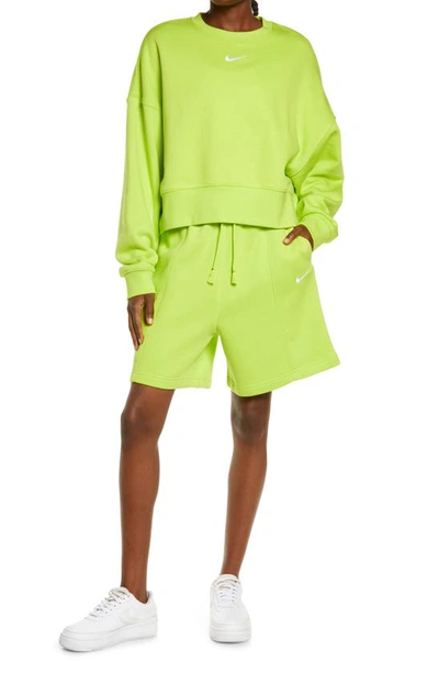 Shop Nike Sportswear Essential Fleece Shorts In Atomic Green/ White