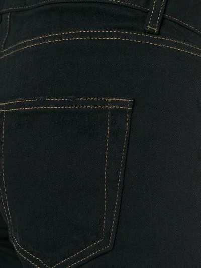 Shop Saint Laurent Ripped Slim Fit Jeans In Black