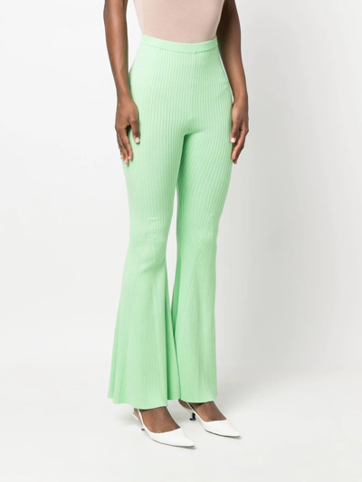 Shop Self-portrait Ribbed-knit Flared Trousers In Grün