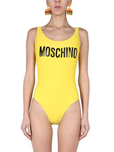Shop Moschino Logo One Piece Swimsuit In Giallo