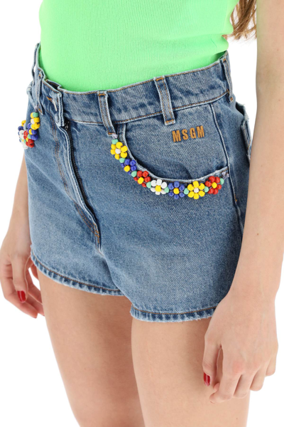 Shop Msgm Denim Shorts With Bead Floral Detailing In Blue