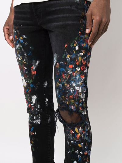 Amiri Skinny-fit Distressed Paint-splattered Jeans In Black