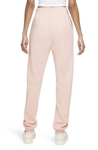 Shop Nike Sportswear Essential Fleece Pants In Pale Coral/ White