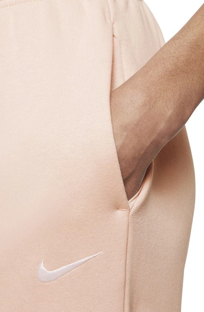 Shop Nike Sportswear Essential Fleece Pants In Pale Coral/ White