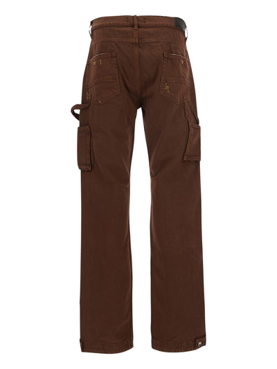 Shop Amiri Trousers In Brown