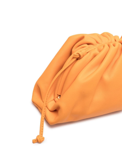 Shop Bottega Veneta Mini Leather Pouch Bag In Orange