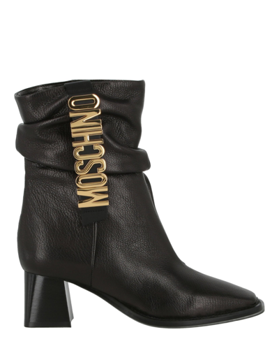 Shop Moschino Logo Leather Ankle Boots In Black