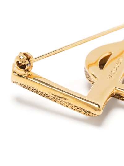 Shop Saint Laurent Textured Logo Letter Brooch In Gold