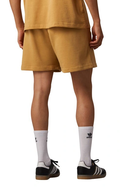 Shop Adidas Originals Adidas X Pharrell Williams Humanrace Sweat Shorts In Golden Beige