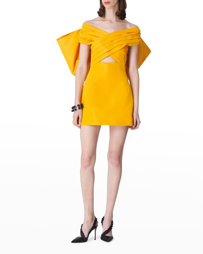 Shop Carolina Herrera Crisscross Off-the-shoulder Bow-back Mini Dress In Goldenrod