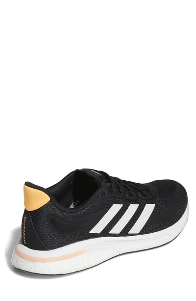 Adidas Originals Supernova Running Shoe In Black/ White/orange