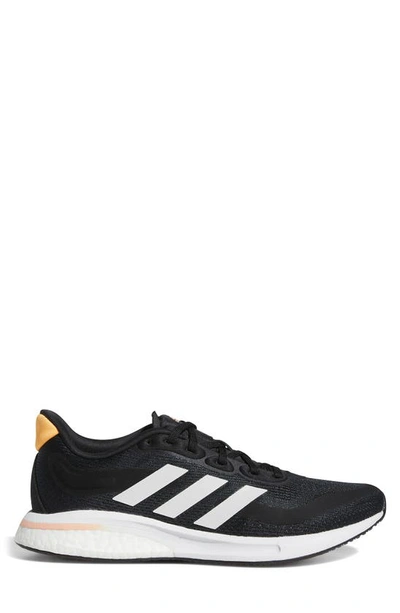 Adidas Originals Supernova Running Shoe In Black/ White/orange
