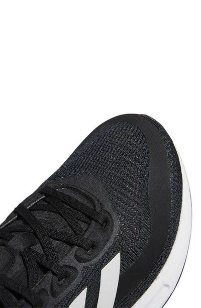 Adidas Originals Supernova Running Shoe In Black/ White/orange