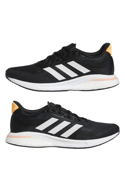 Adidas Originals Supernova Running Shoe In Black/ White/orange