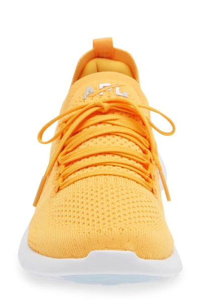 Shop Apl Athletic Propulsion Labs Techloom Breeze Knit Running Shoe In Mango / Silver / White