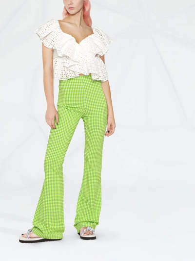 Shop Msgm Check-pattern Flared Trousers In Grün