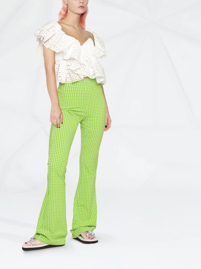 Shop Msgm Check-pattern Flared Trousers In Grün