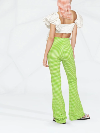 Shop Msgm Check-pattern Flared Trousers In Grün