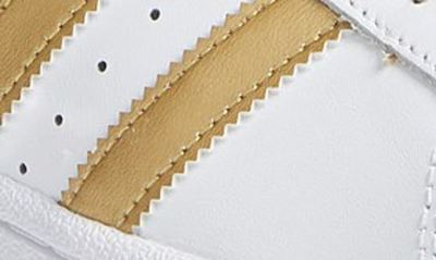 Shop Adidas Originals Superstar Sneaker In White/ Gold