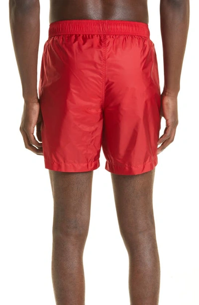 Shop Moncler Logo Patch Swim Trunks In 455-red