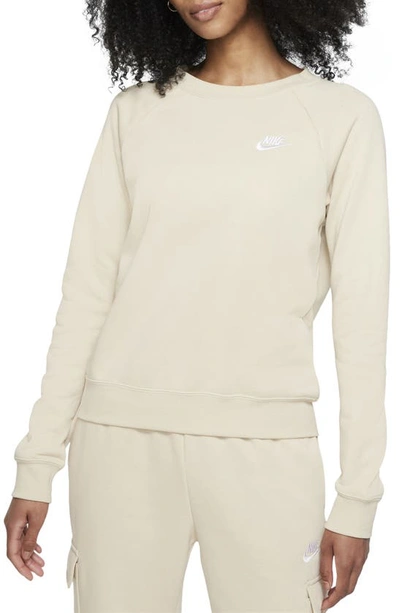 Shop Nike Sportswear Essential Fleece Crewneck Sweatshirt In Rattan/ White