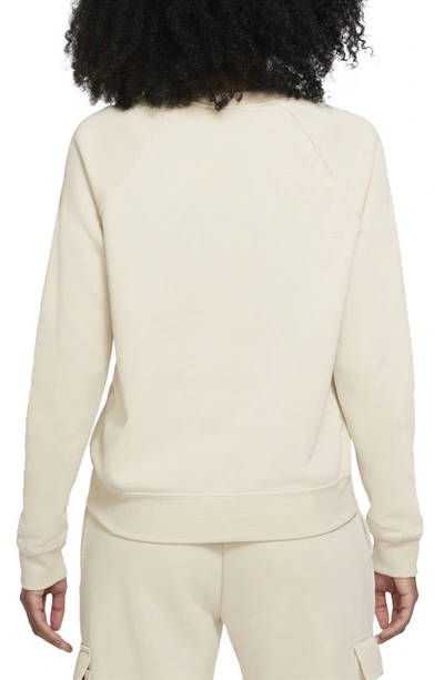 Shop Nike Sportswear Essential Fleece Crewneck Sweatshirt In Rattan/ White