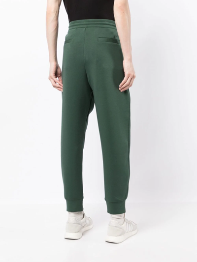 Shop Emporio Armani Embroidered Logo Tapered Track Trousers In Grün