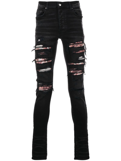 Shop Amiri Ripped Skinny Jeans In Schwarz