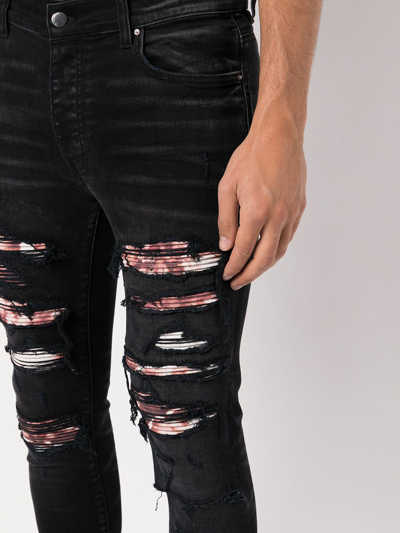 Amiri Ripped Skinny Jeans In Schwarz