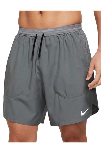 Shop Nike Dri-fit Stride 2-in-1 Running Shorts In Smoke Grey/ Silver