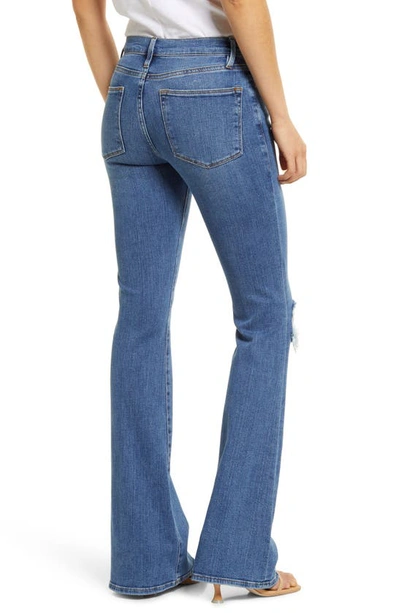 Shop Frame Le High Waist Flare Jeans In Sunfaded Rips
